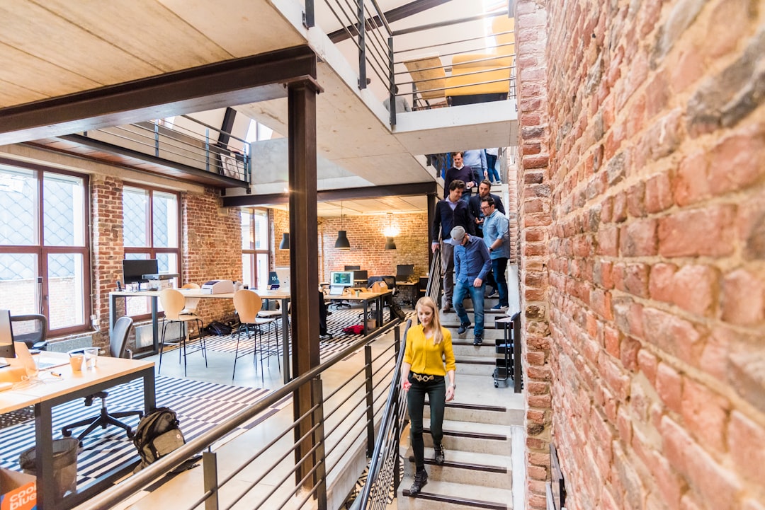 Contemporary technology workplace with colleagues and collaborative spaces